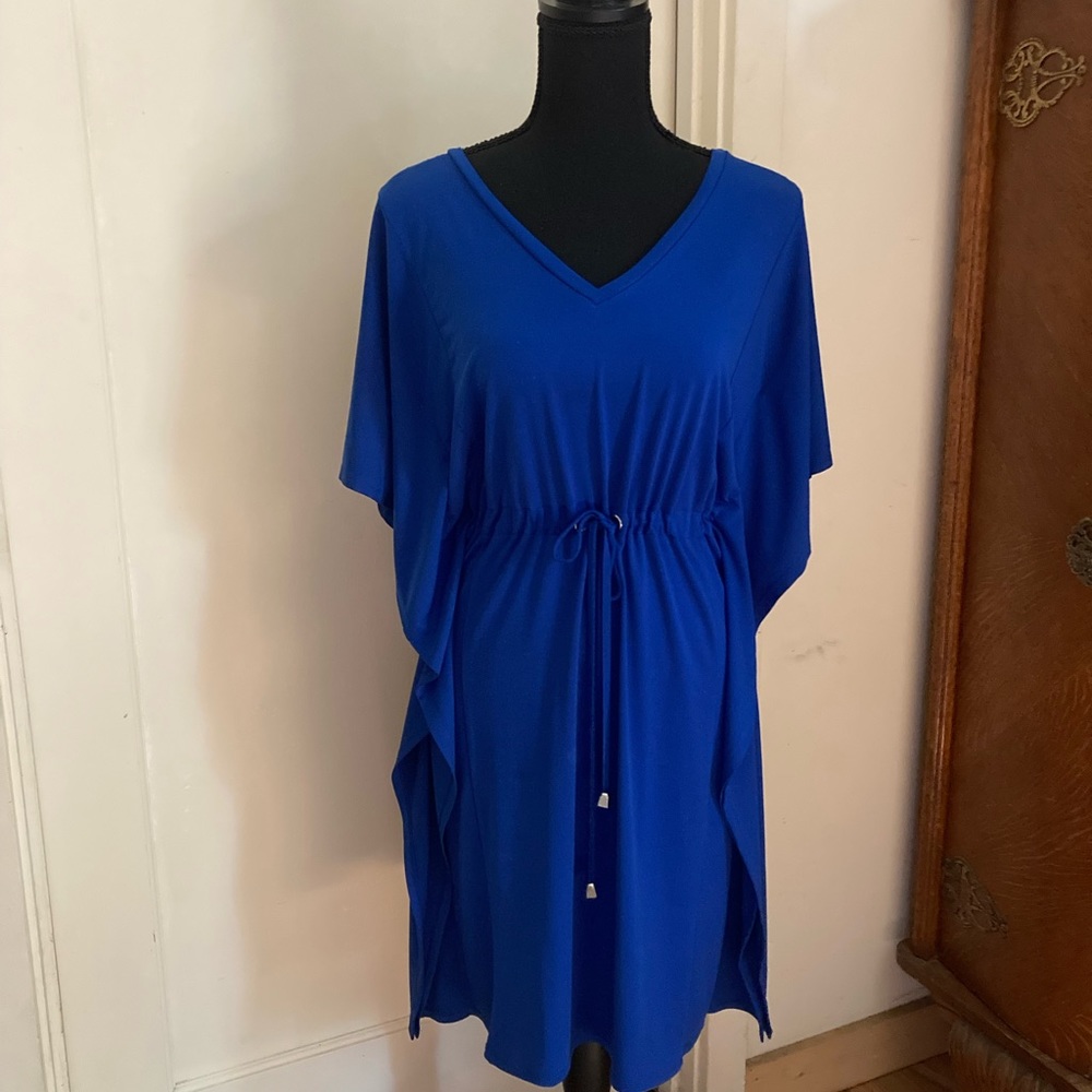 Tea length blue Calvin Klein dress. Cinches at the waist. Has a nautical feel